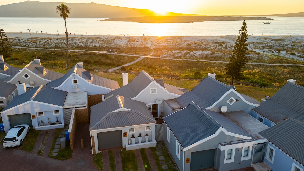 This aerial view shows it best: the estate backs straight onto the beach, no roads to cross.