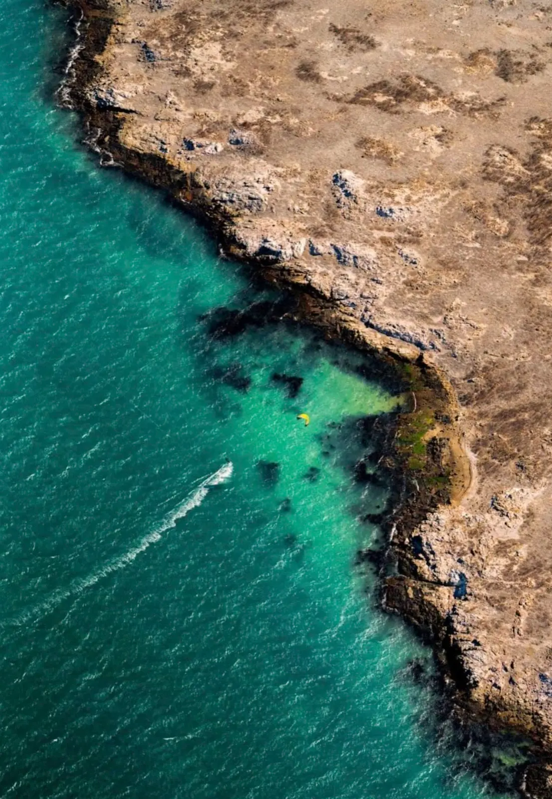 The turquoise shallows and rocky points that make this stretch of coast one of the best flat-water kite spots in South Africa
