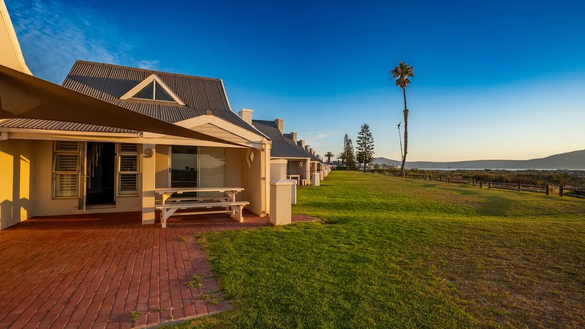 The open lawn between houses, perfect for gear setup or kids playing